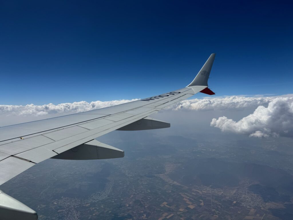 Aeromexico airplane wing in flight.